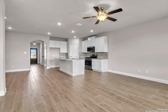 6538 Scooby Acres, San Antonio, TX 78108 - kitchen featuring stainless steel appliances, arched walkways, ceiling fan, open floor plan, and recessed lighting