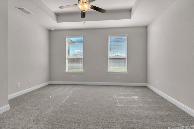6538 Scooby Acres, San Antonio, TX 78108 - carpeted empty room with a ceiling fan, a tray ceiling, and baseboards