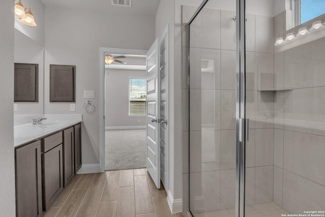 6538 Scooby Acres, San Antonio, TX 78108 - full bath featuring vanity, ceiling fan, a stall shower, and wood finish floors
