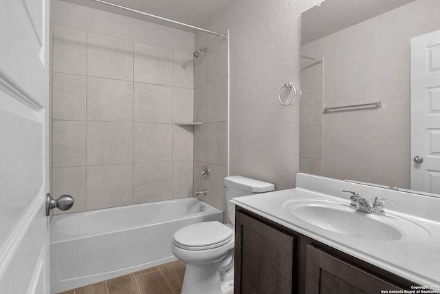 6538 Scooby Acres, San Antonio, TX 78108 - full bath with toilet, vanity, wood finished floors, shower / bathtub combination, and a textured wall