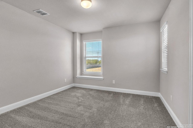 6538 Scooby Acres, San Antonio, TX 78108 - carpeted empty room featuring plenty of natural light and baseboards