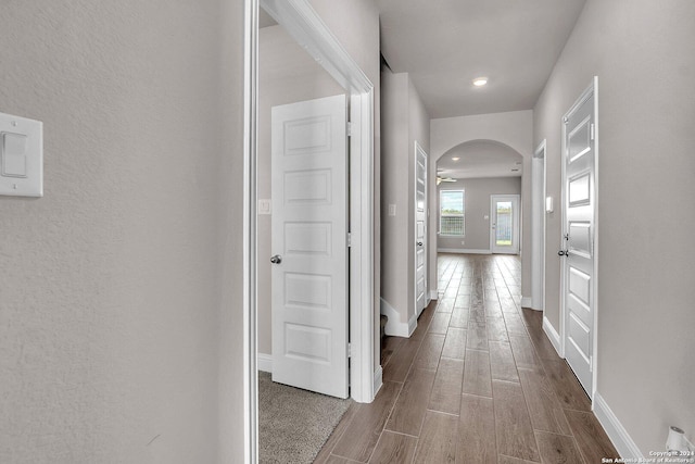 6538 Scooby Acres, San Antonio, TX 78108 - corridor featuring arched walkways, dark wood-type flooring, and baseboards