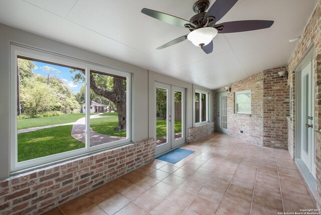 123 Serene Creek Ln, Mcqueeney, TX 78123 - unfurnished sunroom with french doors, lofted ceiling, and ceiling fan