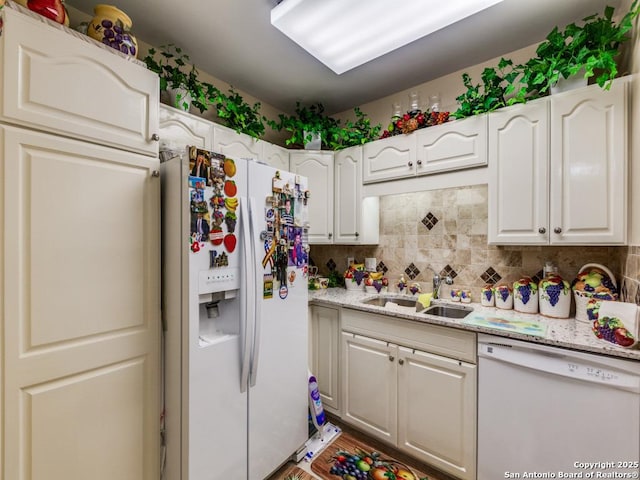 1 Towers Park Unit 1813, San Antonio, TX 78209 - kitchen featuring white appliances, a sink, tasteful backsplash, and white cabinets