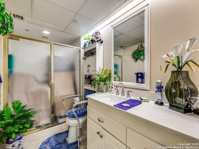1 Towers Park Unit 1813, San Antonio, TX 78209 - full bathroom featuring a drop ceiling, vanity, toilet, a shower stall, and tile patterned floors
