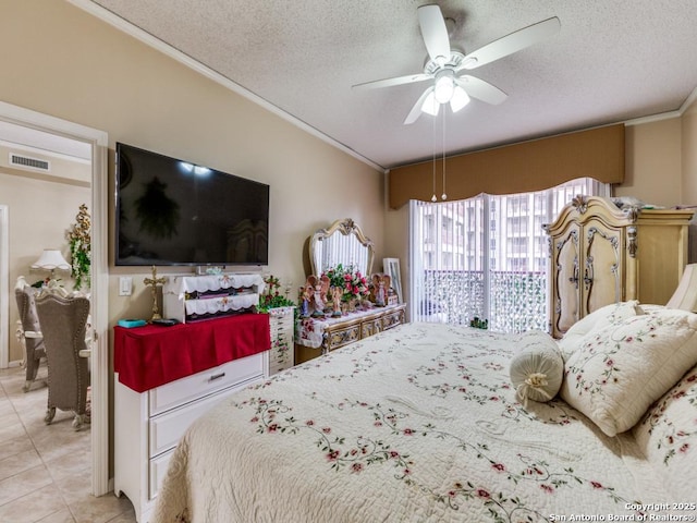 1 Towers Park Unit 1813, San Antonio, TX 78209 - bedroom with ornamental molding, a textured ceiling, tile patterned floors, and a ceiling fan