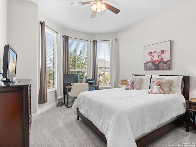 4508 River Rock, Marion, TX 78124 - bedroom with light carpet, baseboards, a ceiling fan, and a desk