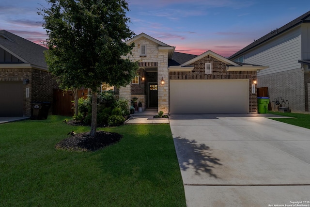 12614 Big Vly, San Antonio, TX 78254 - view of front of house with an attached garage, stone siding, a front lawn, and driveway