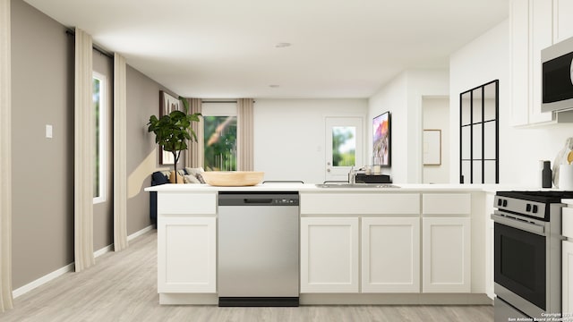 3542 Glade Crk, San Antonio, TX 78245 - kitchen with appliances with stainless steel finishes, a sink, light wood-style floors, white cabinets, and light countertops