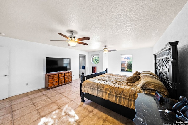 9014 Camino Rey, San Antonio, TX 78245 - bedroom featuring a ceiling fan and a textured ceiling