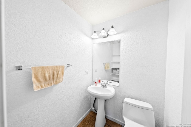 9014 Camino Rey, San Antonio, TX 78245 - bathroom with toilet and a textured wall