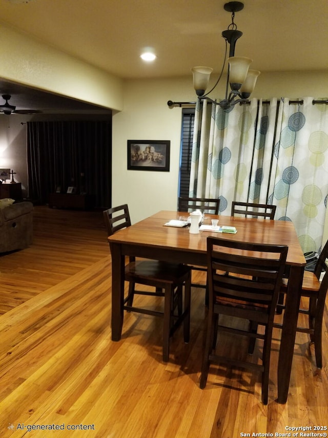 218 E Antonio, Uvalde, TX 78801 - dining space featuring light wood-style flooring and a chandelier