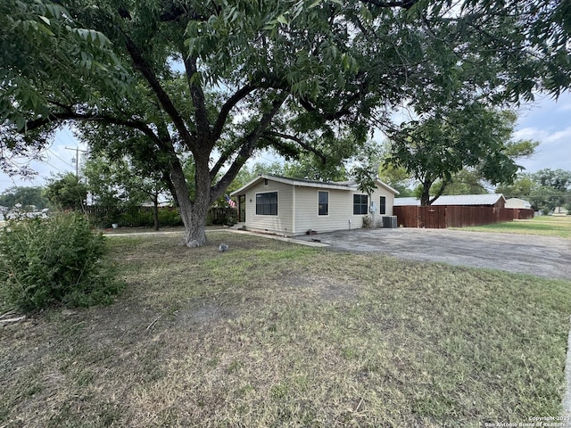 218 E Antonio, Uvalde, TX 78801 - view of front facade featuring asphalt driveway and central AC