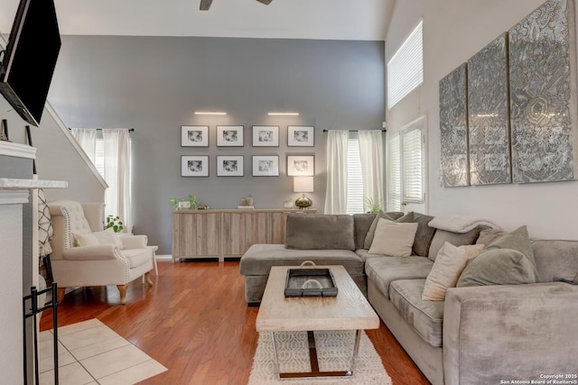 6039 Woodway Ct, San Antonio, TX 78249 - living room featuring a high ceiling, wood finished floors, and ceiling fan
