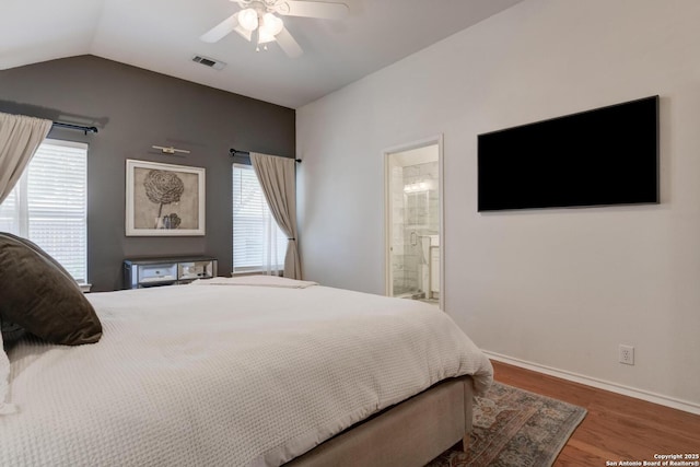 6039 Woodway Ct, San Antonio, TX 78249 - bedroom featuring multiple windows, wood finished floors, lofted ceiling, baseboards, and ceiling fan