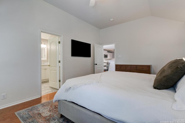 6039 Woodway Ct, San Antonio, TX 78249 - bedroom with wood finished floors, lofted ceiling, ceiling fan, ensuite bath, and baseboards