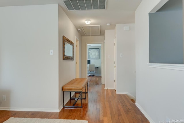 6039 Woodway Ct, San Antonio, TX 78249 - corridor featuring attic access, hardwood / wood-style floors, and baseboards