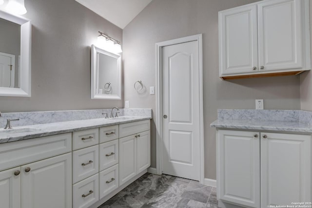 6039 Woodway Ct, San Antonio, TX 78249 - full bath featuring double vanity, lofted ceiling, marble finish flooring, and baseboards