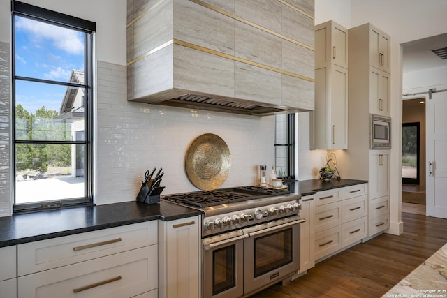 121 Greystone Pt, Boerne, TX 78006 - kitchen featuring stainless steel appliances, custom exhaust hood, decorative backsplash, and dark countertops
