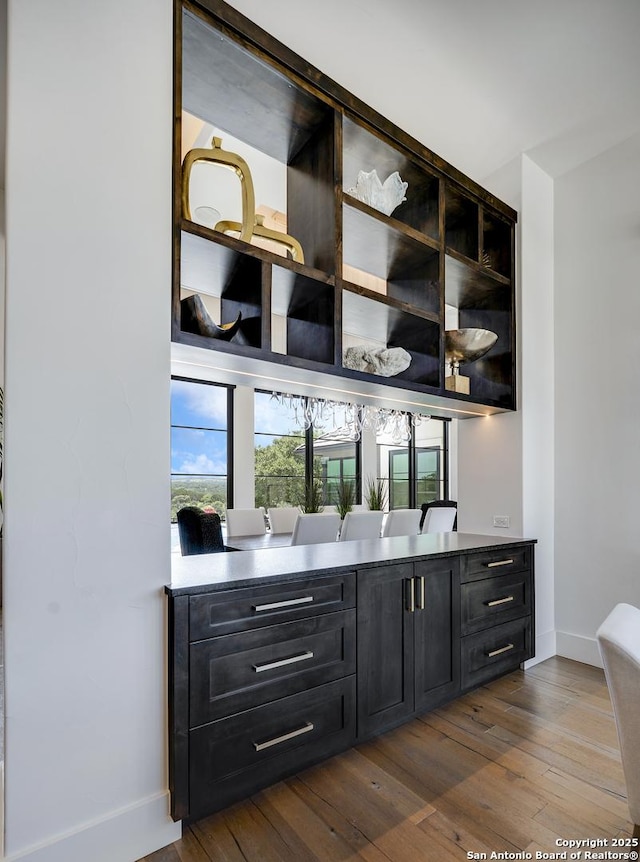 121 Greystone Pt, Boerne, TX 78006 - bar area featuring baseboards and dark wood-type flooring
