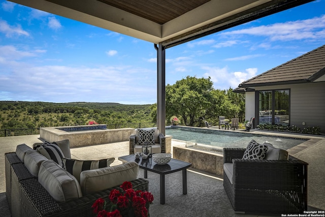 121 Greystone Pt, Boerne, TX 78006 - view of patio with an outdoor pool, an outdoor hangout area, and a view of trees