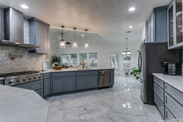 18210 Crystal Ridge Dr, San Antonio, TX 78259 - kitchen with appliances with stainless steel finishes, wall chimney exhaust hood, a sink, backsplash, and a ceiling fan