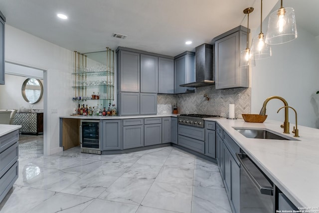 18210 Crystal Ridge Dr, San Antonio, TX 78259 - kitchen with wall chimney range hood, wine cooler, a sink, gray cabinets, and recessed lighting