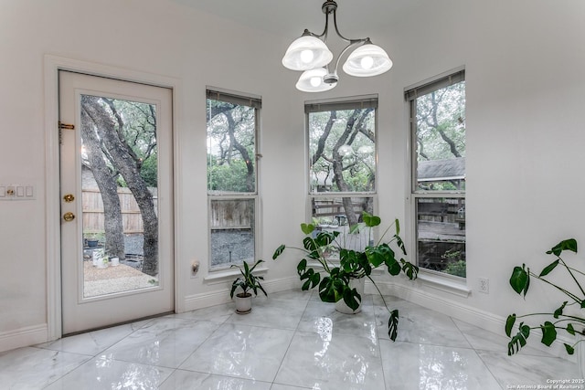 18210 Crystal Ridge Dr, San Antonio, TX 78259 - doorway with healthy amount of natural light, a chandelier, and baseboards