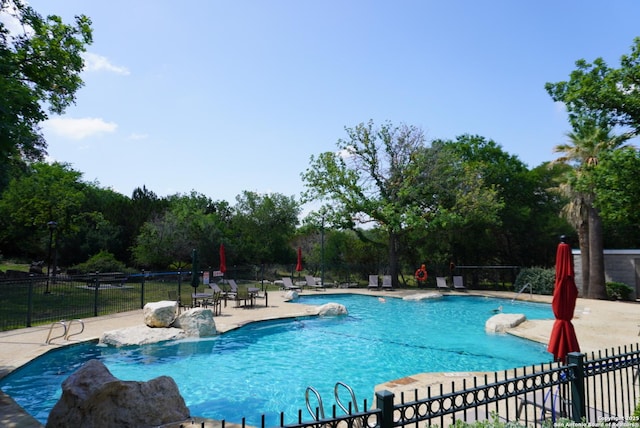 18210 Crystal Ridge Dr, San Antonio, TX 78259 - community pool with a patio area and view of scattered trees