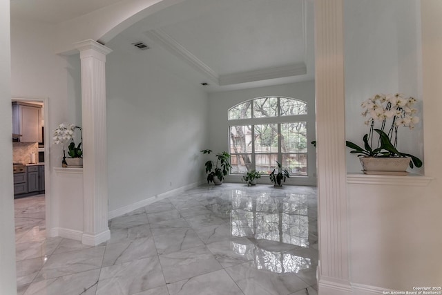 18210 Crystal Ridge Dr, San Antonio, TX 78259 - corridor featuring decorative columns, light marble finish floors, a tray ceiling, arched walkways, and baseboards