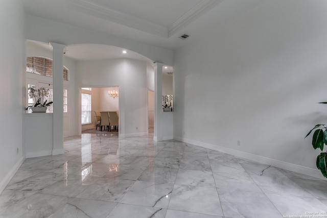 18210 Crystal Ridge Dr, San Antonio, TX 78259 - empty room featuring ornate columns, a chandelier, light marble finish floors, ornamental molding, and baseboards
