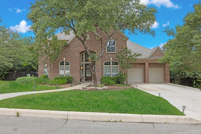 27711 Woodway Bnd, Boerne, TX 78006 - view of front of house featuring concrete driveway, an attached garage, and brick siding