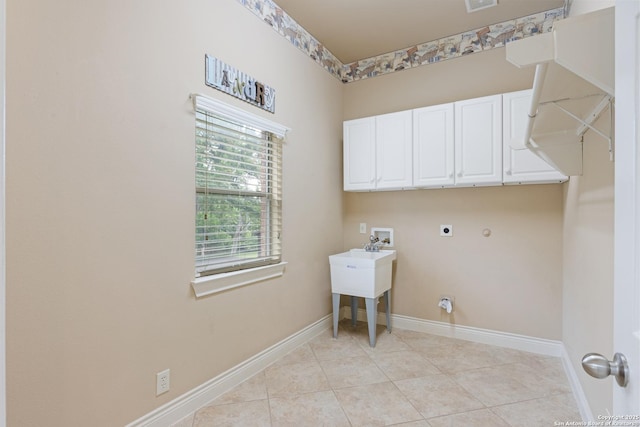 27711 Woodway Bnd, Boerne, TX 78006 - washroom featuring electric dryer hookup, cabinet space, washer hookup, and light tile patterned floors