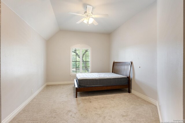 27711 Woodway Bnd, Boerne, TX 78006 - bedroom with light colored carpet, lofted ceiling, and a ceiling fan