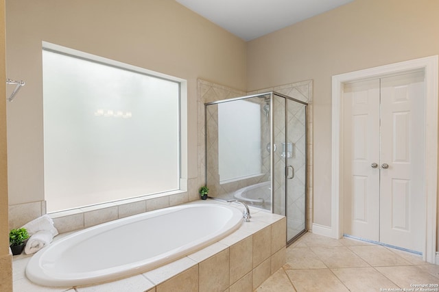 27711 Woodway Bnd, Boerne, TX 78006 - full bath with a garden tub, a stall shower, and tile patterned flooring