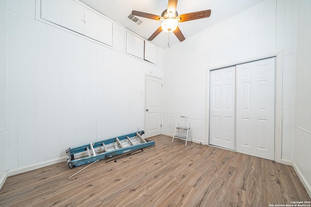 2310 W Houston St, San Antonio, TX 78207 - unfurnished bedroom with wood finished floors, a ceiling fan, and a closet