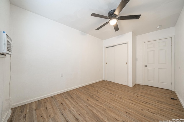 2310 W Houston St, San Antonio, TX 78207 - unfurnished bedroom with wood finished floors and baseboards