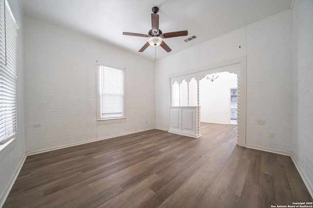 2310 W Houston St, San Antonio, TX 78207 - empty room featuring a ceiling fan, wood finished floors, plenty of natural light, and baseboards