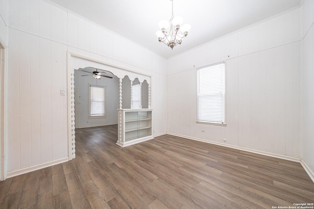 2310 W Houston St, San Antonio, TX 78207 - spare room with wood finished floors, a chandelier, plenty of natural light, crown molding, and baseboards