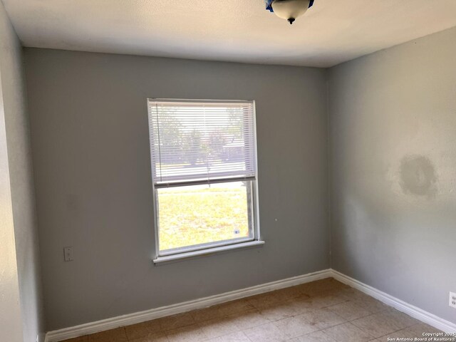 115 Westhaven Pl, San Antonio, TX 78227 - spare room with baseboards and light tile patterned flooring