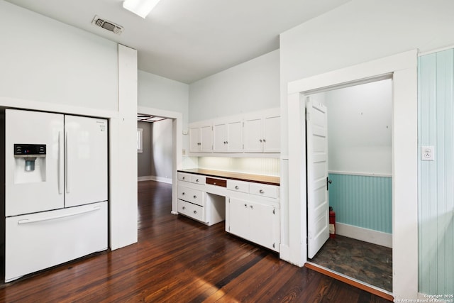 124 Corona, Alamo Heights, TX 78209 - kitchen with white refrigerator with ice dispenser, dark wood-style flooring, white cabinets, baseboards, and a wainscoted wall