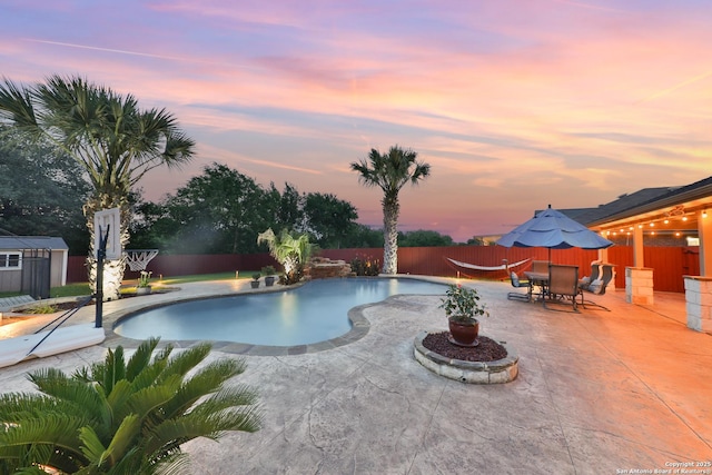 5327 Gemsbuck Chase, San Antonio, TX 78251 - pool at dusk featuring a patio and a fenced backyard
