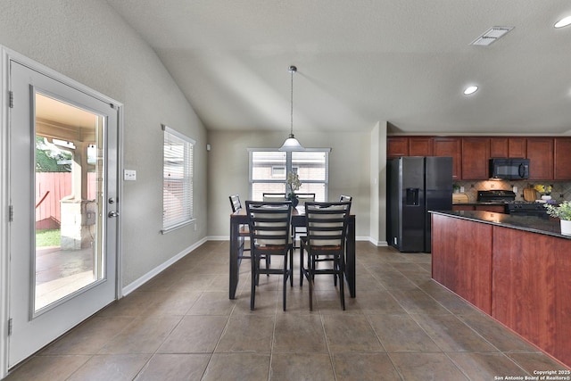 5327 Gemsbuck Chase, San Antonio, TX 78251 - dining room featuring vaulted ceiling, dark tile patterned flooring, recessed lighting, and baseboards
