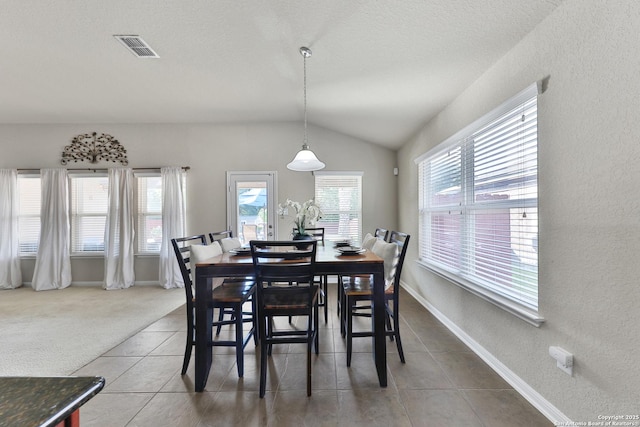 5327 Gemsbuck Chase, San Antonio, TX 78251 - tiled dining space with a textured wall, lofted ceiling, baseboards, and a textured ceiling