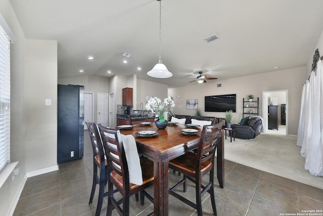 5327 Gemsbuck Chase, San Antonio, TX 78251 - dining area with dark tile patterned floors, ceiling fan, recessed lighting, dark carpet, and baseboards