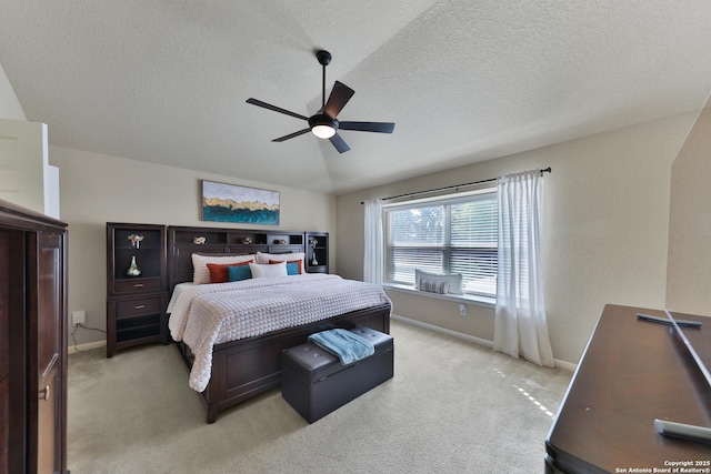 5327 Gemsbuck Chase, San Antonio, TX 78251 - bedroom featuring baseboards, light colored carpet, a textured ceiling, a ceiling fan, and vaulted ceiling