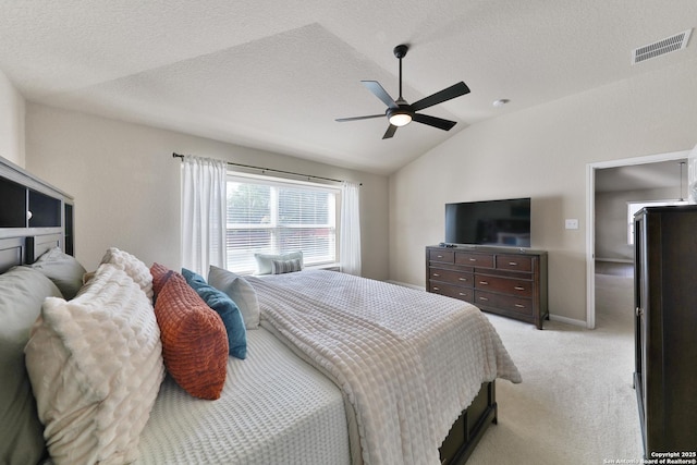 5327 Gemsbuck Chase, San Antonio, TX 78251 - bedroom with vaulted ceiling, light colored carpet, a ceiling fan, and a textured ceiling