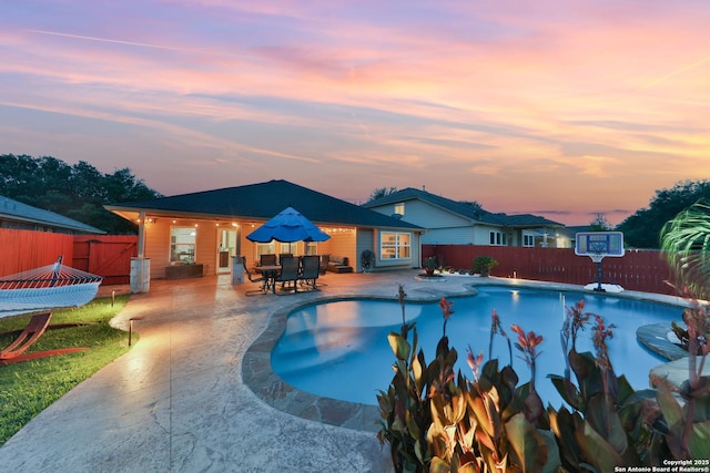 5327 Gemsbuck Chase, San Antonio, TX 78251 - pool at dusk featuring a fenced backyard and a patio area