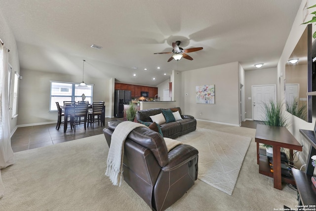 5327 Gemsbuck Chase, San Antonio, TX 78251 - living room with a ceiling fan, baseboards, recessed lighting, light tile patterned floors, and light carpet
