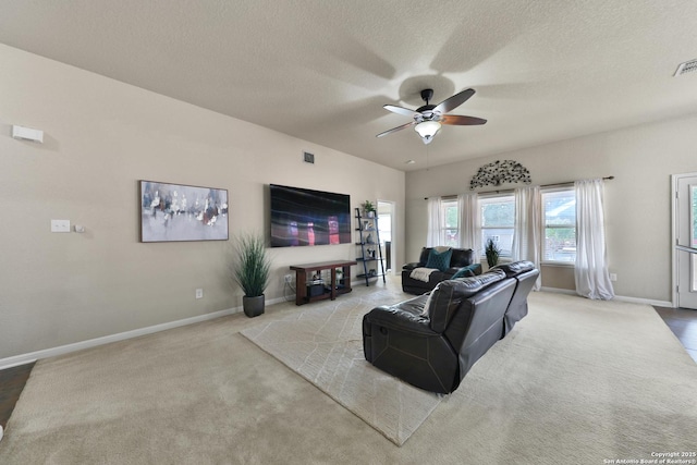5327 Gemsbuck Chase, San Antonio, TX 78251 - carpeted living room with a ceiling fan, baseboards, and a textured ceiling